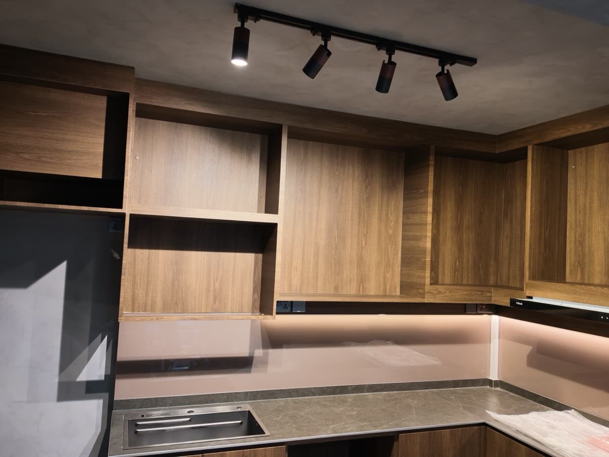 Kitchen cabinets after walnut wood-grain wrapping