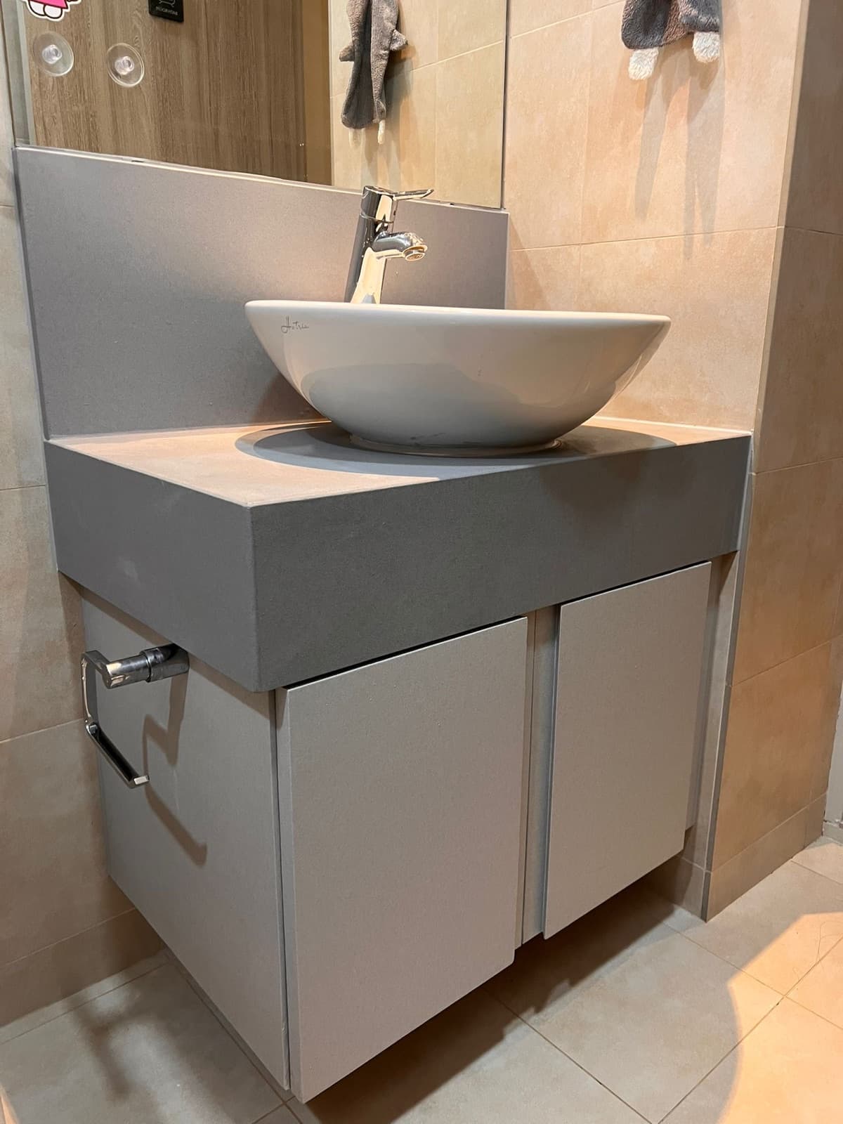 Bathroom vanity cabinet and countertop wrapped in stone-grey film
